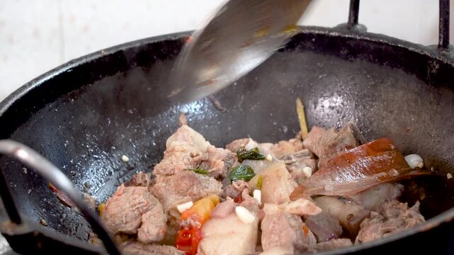 Cooking pork in traditional tribal style of Northeast India Assam 1