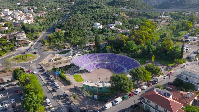 Aerial View of Open Air Amphitheater in Kalamata Surrounded by Roads, Greenery and Hills, Peloponnese, Greece