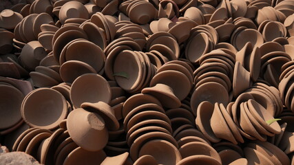 Fototapeta premium Stacked Handmade Clay Bowls Creating Pottery Texture Background