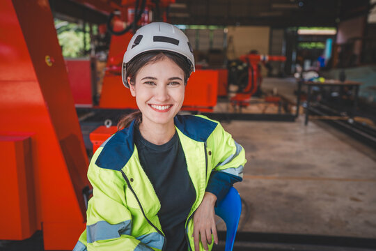 Female automation engineer standing in modern industrial.