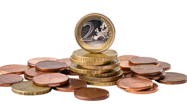 Stack of Euro coins two euro coin on top, scattered copper and gold currency