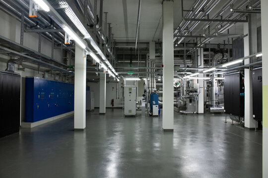 Lugano, Switzerland - 18 March 2026: View of the Swiss National Supercomputing Centre featuring industrial piping and electrical infrastructure in a technical facility.