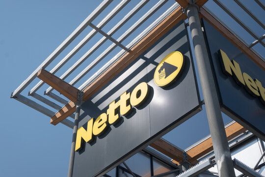 Advertising banner with the name of a retail chain in Poland, Netto. Poznań, Poland June 21, 2026