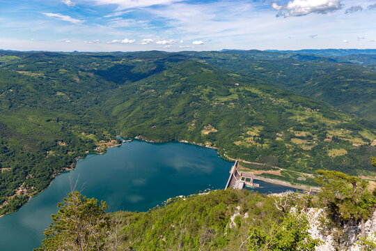 Spectacular high angle perspective of the Bajina Basta dam on the Drina River viewed from a steep cliff overlook in Tara National Park Serbia