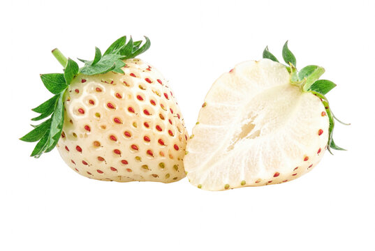 White Pineberries Whole and Sliced with Red Seeds on Dark