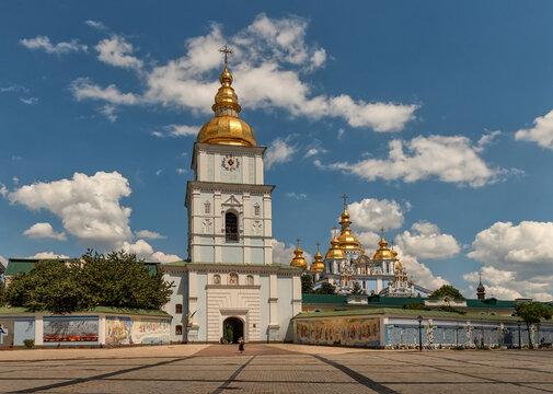 Kyiv, Ukraine - 11 June 2026: View of St. Michael's Golden-Domed Monastery with its blue bell tower and golden domes under a bright sky with white clouds in Kyiv, Ukraine.