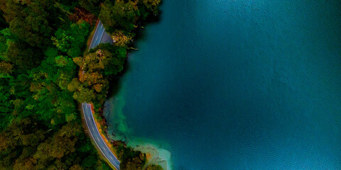 Aerial view of forest lakes and winding roads, Milford, New Zealand © zhang
