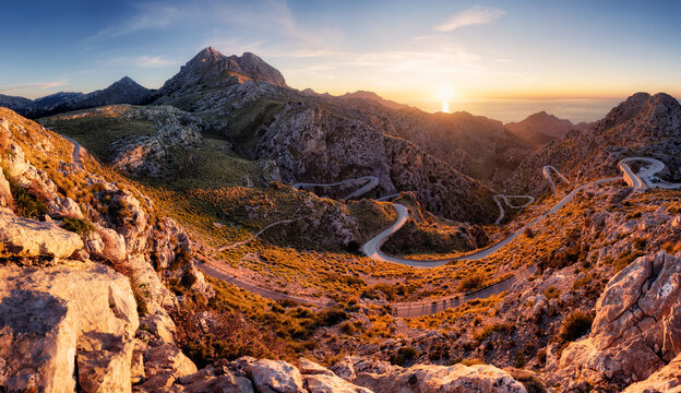 Sunset in spanish mountain panorma with road in Sierra de Tramontana Coll dels Reis, island of Mallorca