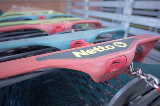 Shopping cart of the Netto retail chain. Poznań, Poland June 21, 2026.
