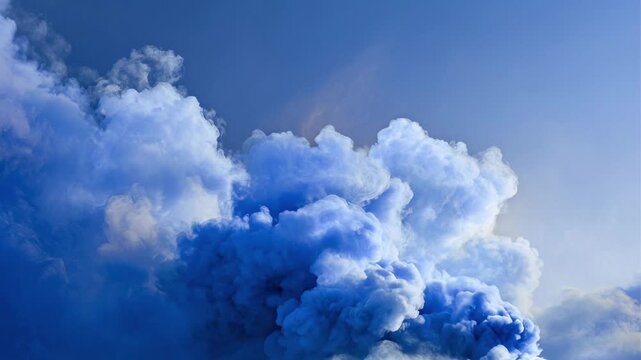 Dramatic blue smoke plumes rise against a clear sky