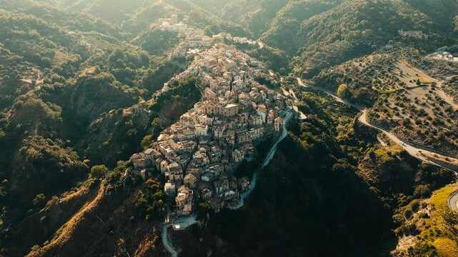 aerial panorama of Badolato old town at golden hour
