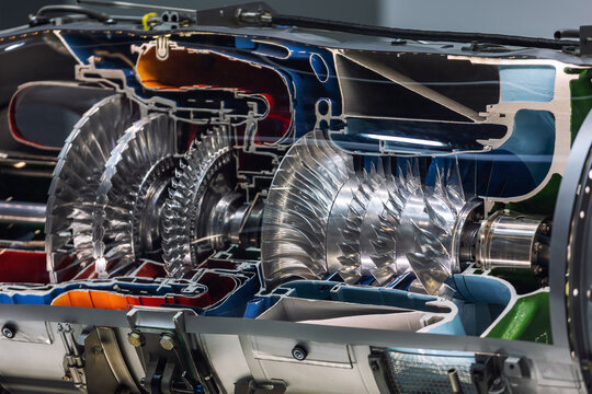 Cross section modern jet engine intricate turbine stages compressor blades internal airflow pathways. Detailed aerospace advanced propulsion technology precision engineering commercial aviation