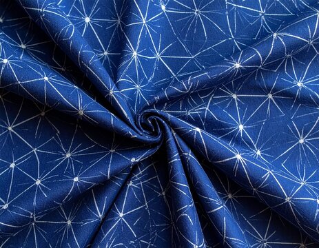 Folded indigo dyed Japanese tenugui cloth with white kasuri pattern