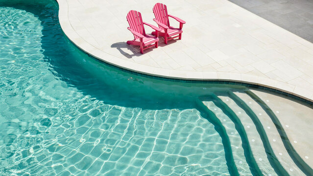 Two Pink Adirondack Chairs at Swimming Pool Terrace