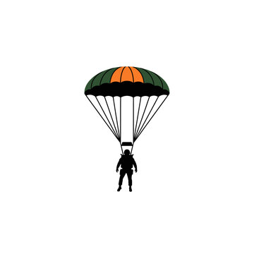 Parachutist descending with a green and orange round canopy