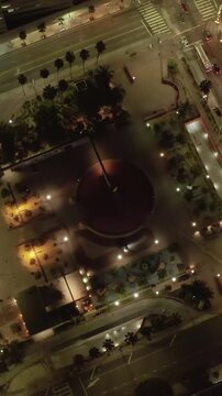 Pershing square in Downtown Los Angeles, California at Night with lit up glowing city street lights, Aerial Birds Eye Overhead Top Down View
