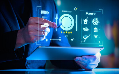 Close-up of a person using a tablet with glowing digital food delivery and restaurant menu interface. © svetazi