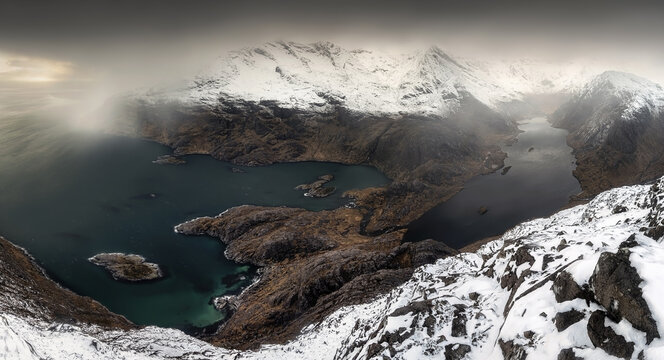 View of the snow-capped Cuillin mountains and Loch Coruisk from Sgurr na Stri in Isle of Skye, Scotland, United Kingdom.