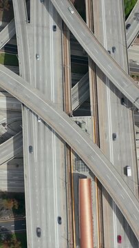 AERIAL: Close Flight over Judge Pregerson Huge Interchange Connection showing multiple Roads, Bridges, Highway with little car traffic in Los Angeles, California on Beautiful Sunny Day 