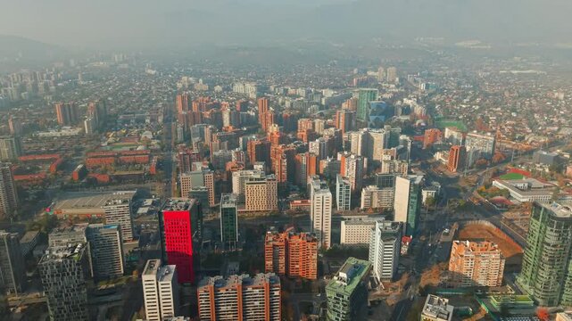 Santiago de Chile Aerial Dolly Out Mixed Corporate and Residential Skyscrapers with Red Modern Office Building in Las Condes