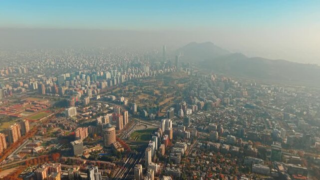 Aerial Establishing of Sanhattan Cityscape with Andes Mountain Background in Santiago de Chile and Club de Golf Los Leones