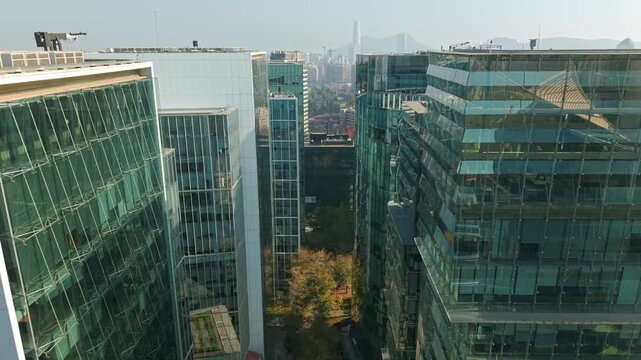 Drone Aerial Dolly In Between Glass Skyscrapers in Nueva Las Condes Business District of Santiago de Chile