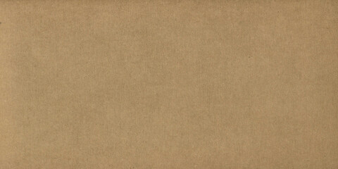 Brown kraft paper sheet - seamless background texture. Recycled cardboard carton packaging banner.