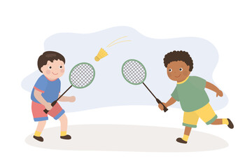 Two happy boys playing dynamic game of badminton together with rackets and shuttlecock. Friendship, active lifestyle, sport and childhood fun. © Marina