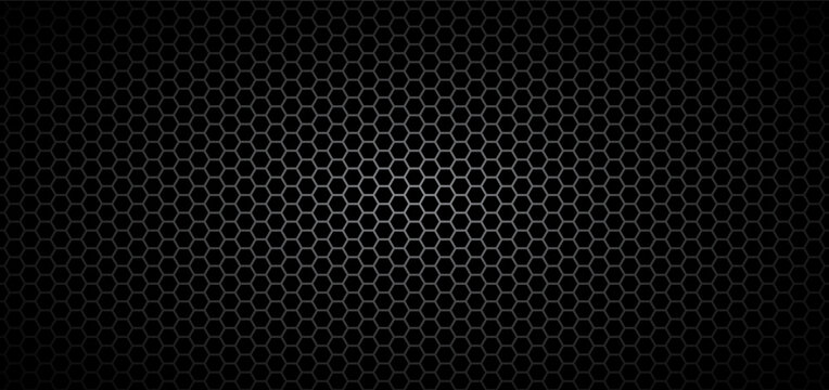 Dark metal hexagon mesh with honeycomb grid pattern. Industrial steel texture background featuring perforated surface and geometric grill structure.