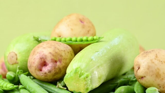 video of young yellow potatoes with baby peas and zucchini