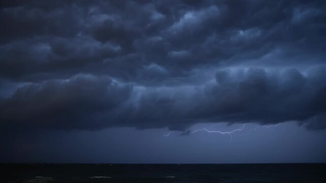 Reacting to rising horizon glow, shelf cloud releasing forked lightning over ocean, lighting waves