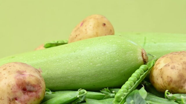video of young yellow potatoes with baby peas and zucchini