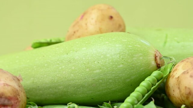 video of young yellow potatoes with baby peas and zucchini