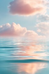 Fototapeta premium Sunset over calm ocean water. Pink clouds reflected on gentle sea surface. Serene nature landscape for meditation and relaxation. Peaceful horizon background for travel and holiday design.