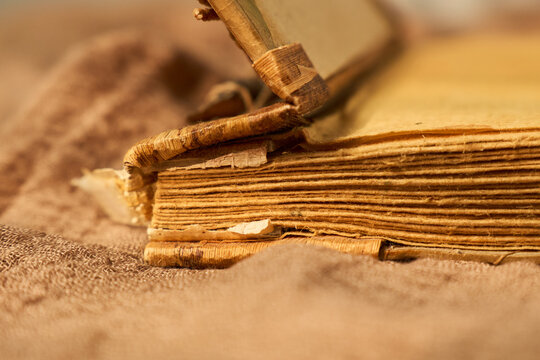 Old pages bring back warm memories. Weathered pages of antique book evoke heartfelt nostalgia and soothing atmosphere