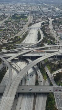 AERIAL: Spectacular Judge Pregerson Interchange showing multiple Roads, Bridges, Highway with little car traffic in Los Angeles, California on Beautiful Sunny Day 