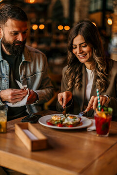 Couple enjoying brunch and conversation at a restaurant