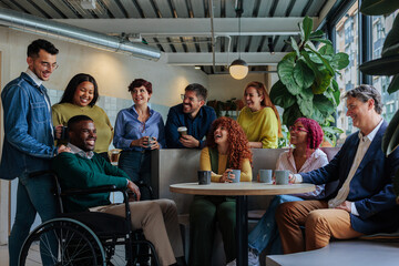 Diverse business team enjoying coffee break at office