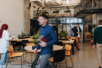 Fototapeta na wymiar Business people collaborating in modern coworking office space
