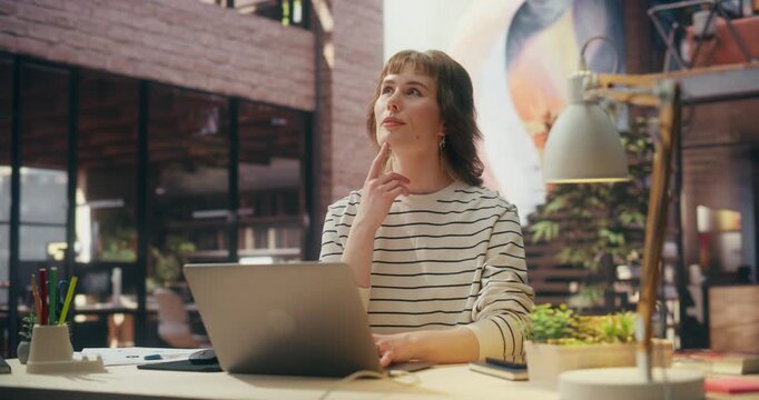 360 Degree. Inspired Woman Uses Laptop in Loft Office, Analyzing Ecommerce Metrics, Optimizing Online Sales Funnel and Pioneering Digital Technology Solutions for Business Growth. Tracking Shot.