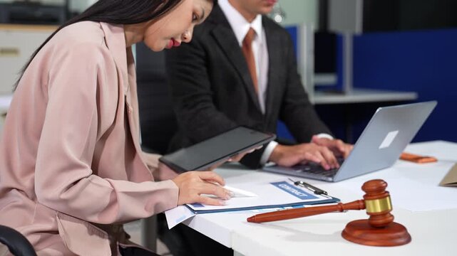 Business lawyer meeting working with paperwork on desk in office workplace for consultant lawyer in office.
