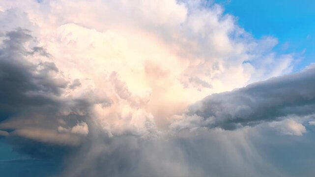A breathtaking cinematic shot of a vast sky filled with rolling clouds drifting across the horizon. The dynamic cloud formations create a dramatic and atmospheric scene, showcasing the beauty and powe
