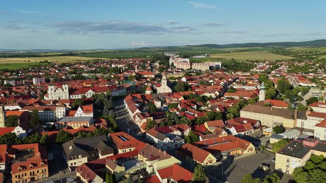 Aerial drone view of the historic town of Skalica in western Slovakia. Traditional red rooftops, church towers, and charming old town architecture surrounded by the scenic Z&aacute;horie countryside during g