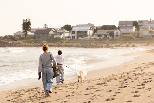 people walking the Coastline of Onrus Beach, Onrus, South Africa