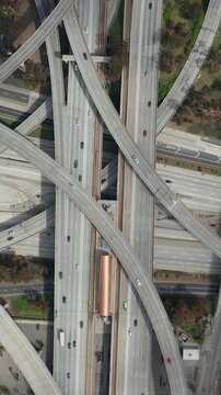 AERIAL: Spectacular Overhead Shot of Judge Pregerson Highway showing multiple Roads, Bridges, Highway with little car traffic in Los Angeles, California on Beautiful Sunny Day 