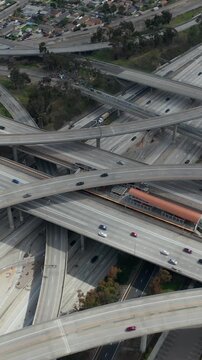 Slowly Circling Aerial View over Judge Pregerson Interchange Highway showing multiple Roads with little car traffic in Los Angeles during times of Coronavirus Covid19 Pandemic on sunny day