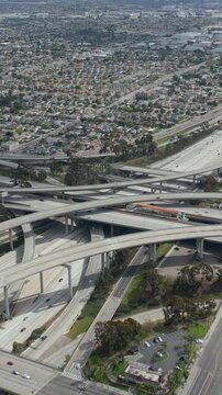 AERIAL: Spectacular Judge Pregerson Interchange showing multiple Roads, Bridges, Highway with little car traffic in Los Angeles, California on Beautiful Sunny Day 