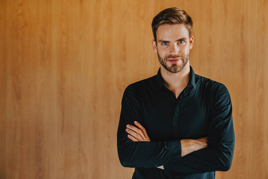 Serious, arms crossed and portrait of business man in office for confidence, professional or leadership mindset. Corporate, financial advisor or male worker for company growth, career pride or startup