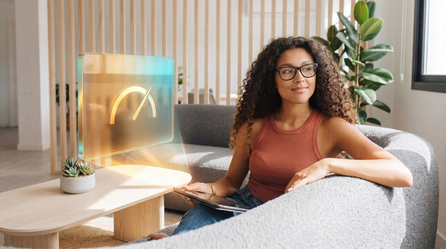 Confident woman reviewing performance indicators on digital display