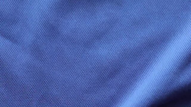 Blue sports clothing fabric football shirt jersey texture close up